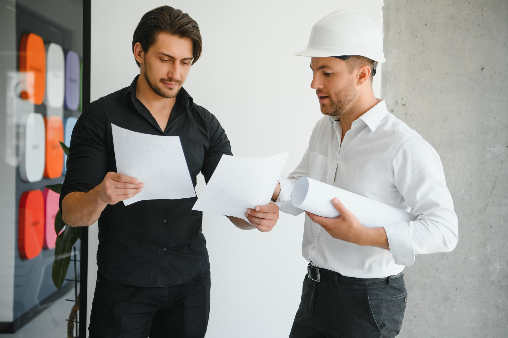 architect-concept-architects-working-with-blueprints-office